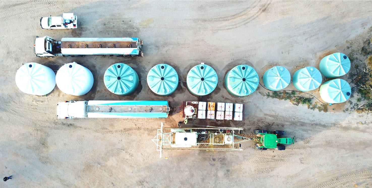 line of Coerco poly water tanks lined up out in the sun